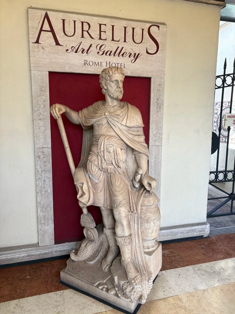 Classical statue inside the Aurelius Art Gallery Rome Hotel in Rome