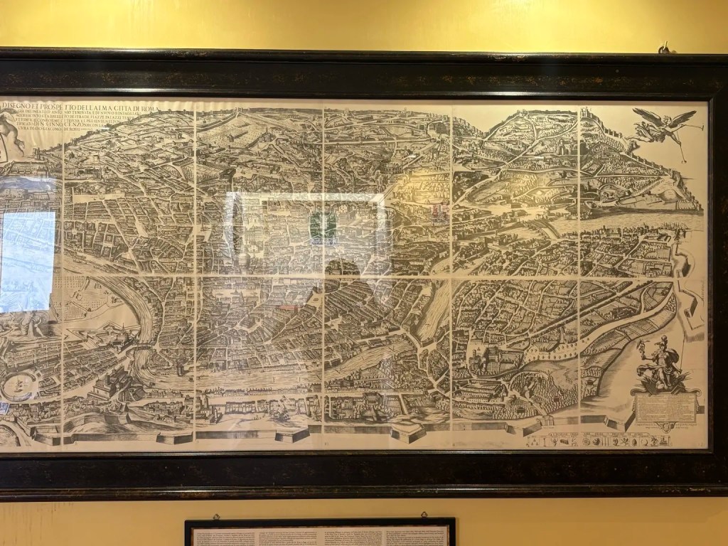Framed historic map of Rome displayed inside the Aurelius Art Gallery Rome Hotel