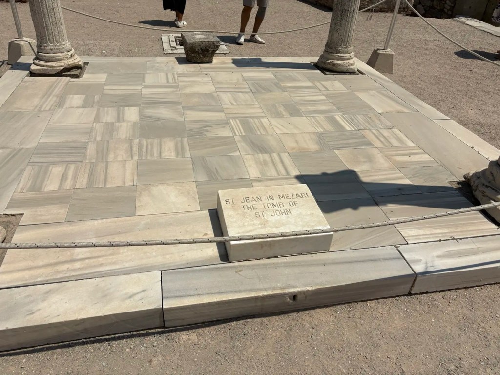 Marble tomb marker identifying the traditional tomb of Saint John the Apostle at the Basilica of Saint John