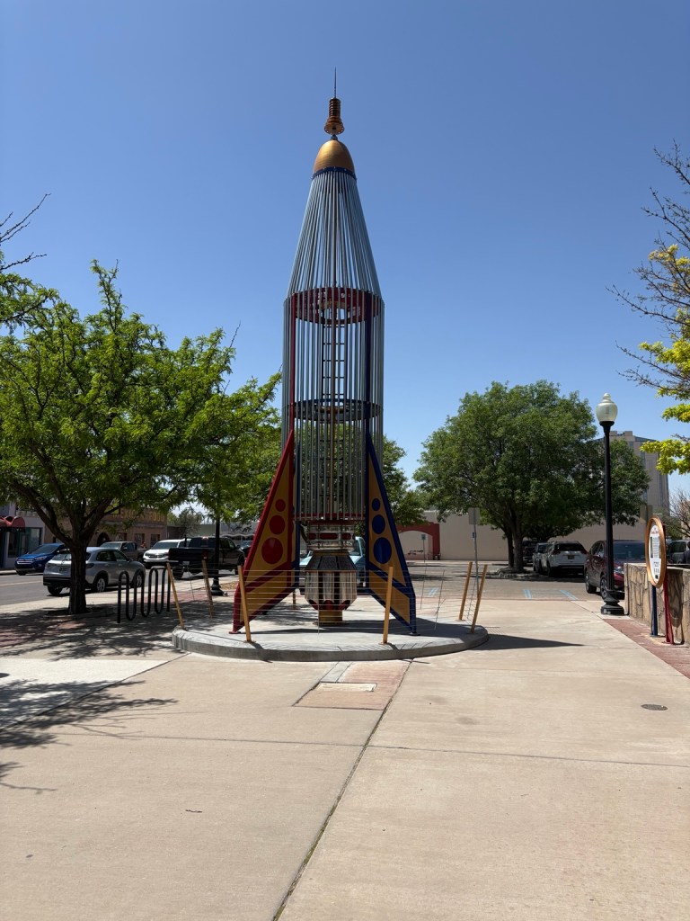 Colorful rocket-shaped outdoor sculpture in Roswell, New Mexico.